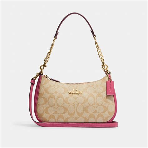 coach signature pink bag.